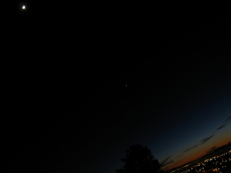 IMG_1969.JPG - The moon, venus, jupiter and mercury form a line from top left to where the horizon hits the right side of the image. This is on the "night scene" setting.