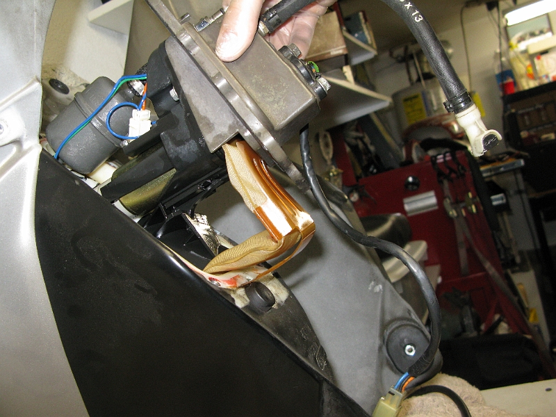 IMG_0130.JPG - The fuel level sensor is the last bit out and has to be angled just right. The floppy tan thing is a coarse filter screen.