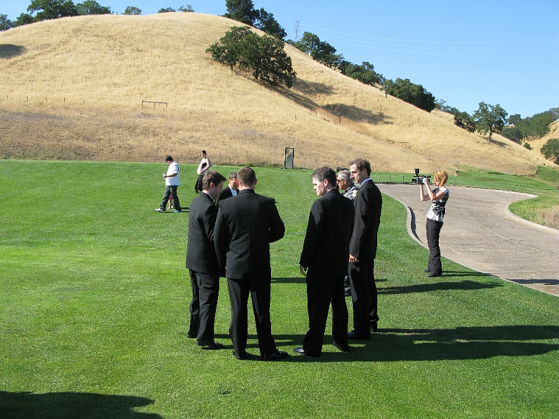 IMG_0195.JPG - Groomsmen huddle up and draw up the first play.