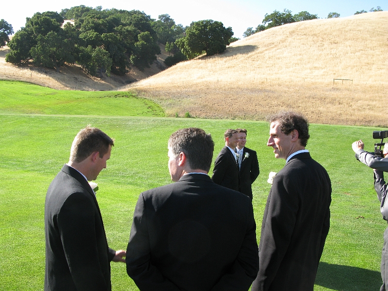 IMG_0196.JPG - Crop out the photographer at right and this isn't a bad candid shot of the team.