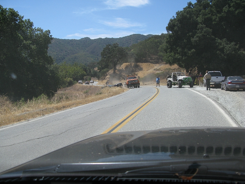 IMG_0536.JPG - All 4 wheels slipping as he pulls the Mustang over the brow of the hill.