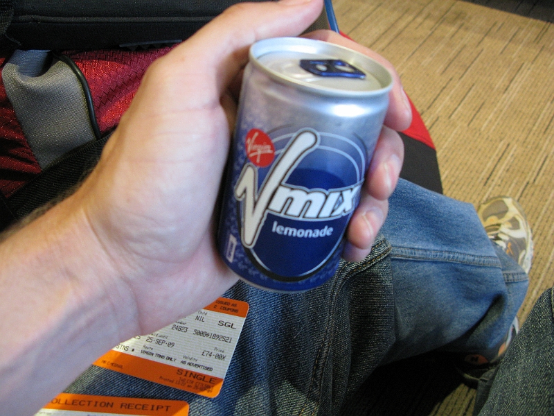 IMG_0724.JPG - Hanging out in the first class lounge. Scoring a free beverage. Sweet.