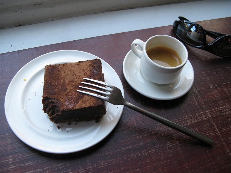 IMG_0944.JPG - Very difficult to describe this treat. Not very heavy, but it seemed dense when you tried to dig into it. The flavor was a paradox as well. Not overly sweet, but fairly chocolatey. It was too much to finish, especially with only a little espresso to wash it down. These cafes were all around town (Noto, I think) and had wifi hotspots. Whenever I was trying to update the map on my iphone I'd look for one of these places.