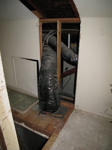 IMG_1692.JPG - Plenum return is in the space to be occupied by the bath. Should be able to work around it though.