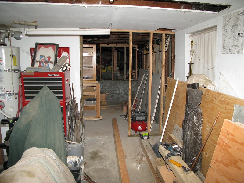 IMG_1761.JPG - They busted out that last bit of concrete foundation wall that was in the way. New framing coming in. Washer/dryer/slop-sink will go behind studs on right.