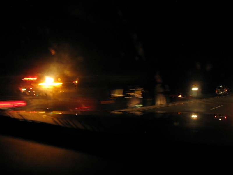 IMG_1869.JPG - Upside down car. Driver sitting on the shoulder with his head in his hands. Probably to hold it on.