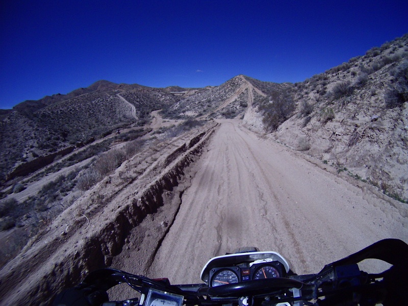 PICT1091.JPG - Those trails are so tempting. Best to not get off course though. This fast road is a relief since the clutch isn't really needed on it.