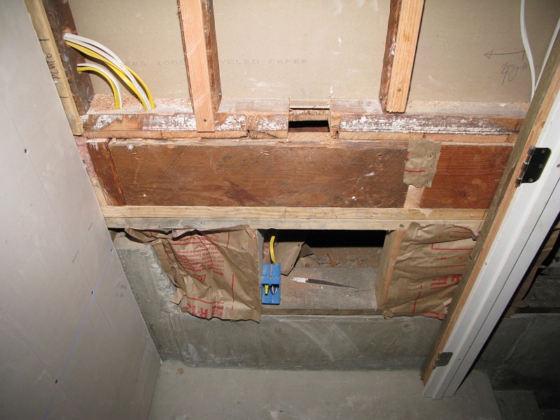 IMG_2139.JPG - The bottom of the route for the coolant lines from the condenser to the central blower.