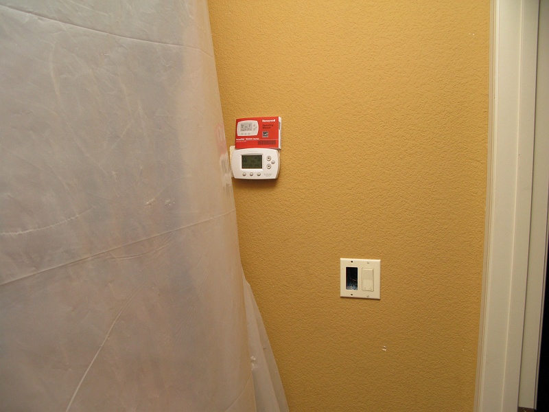 IMG_2194.JPG - New downstairs zone thermostat. Hurray. New manual to read. Booo.
