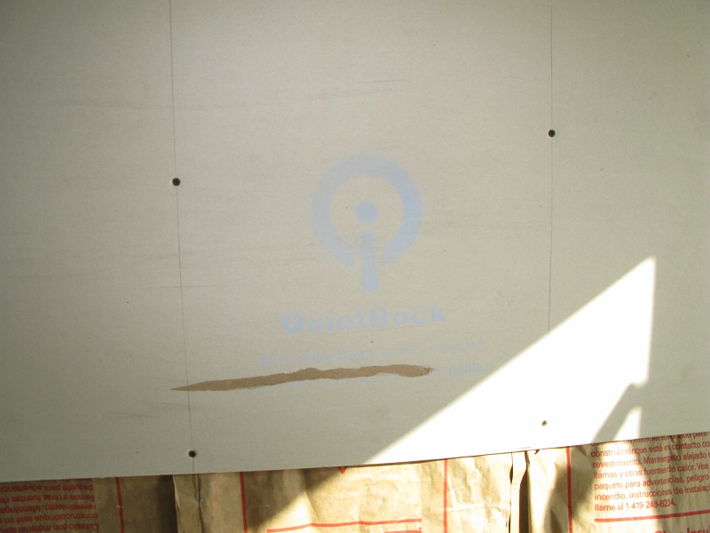 IMG_2231.JPG - Quiet Rock. Should isolate bathroom plumbing noise from the bedroom.  Supposedly is equivalent to like 9 sheets of regular sheetrock.