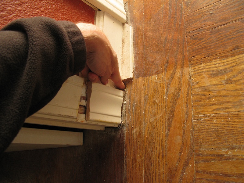 IMG_2526.JPG - Note the gap. The strange 1" wide bit of trim below the baseboard was an attempt to hide that.