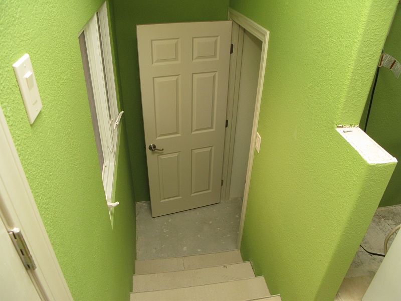 IMG_2731.JPG - Those freshly painted doors are being installed.