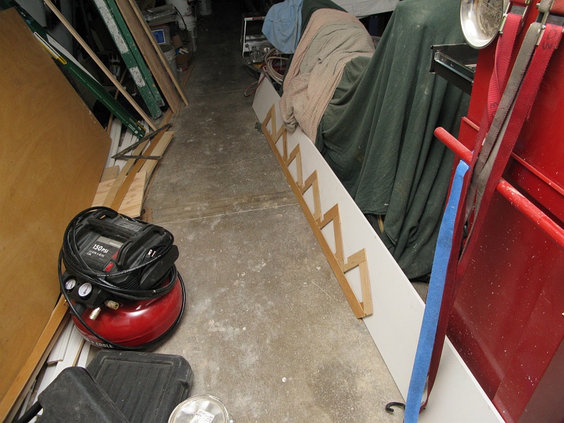 IMG_2776.JPG - Cutting stair trim based on a site specific template.
