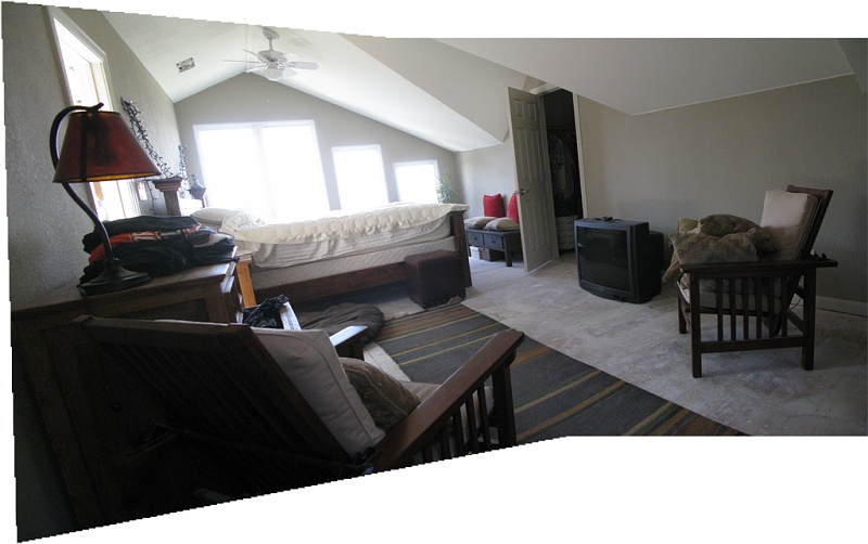 furnished_bedroom.jpg - Pieces of furniture that are refugees from the refinishing work downstairs.