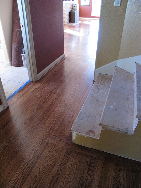 IMG_2860.JPG - The spot where old stairs landed was missing the flooring, but new stuff has been patched in.