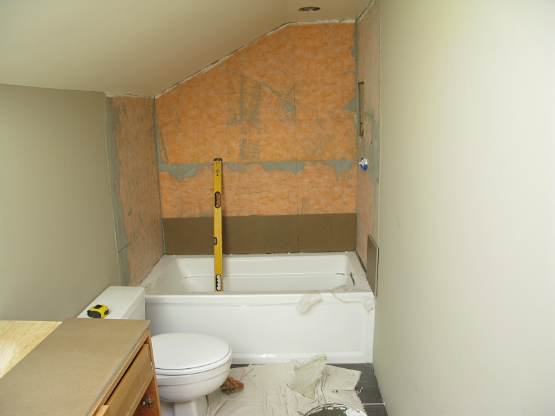 IMG_3027.JPG - First row of tile. Slow going as it has to engage the top lip of the tub.