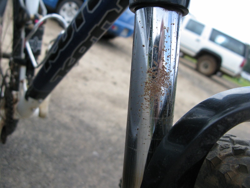 IMG_3408.JPG - Not what you want to see on a working part of the suspension. The oil seal won't like passing back and forth over that rough surface.
