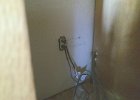 IMG 3946  Power and hose situation for the washer. Gonna have to fill the gap between the wall and the floor when I'm in there next, to keep the mouse out.