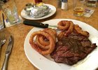IMG 4141  Rib eye was tasty. Onion rings were pretty good. Baked potato was curiously bad.