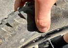 IMG 3380  Dinged the rim and tore the tire in two spots. He later claimed to use Shoe Goo to repair it!