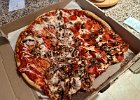 IMG 3468  I wanted to call this a pizzanami, but industry lingo is landslide. The extra sauce and the careless delivery guy were the causes. It was the best tasting pizza I've gotten from Red Boy in a long time.