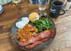 IMG 4792  Eggs good, if a bit small. Biscuit very good. Potatoes crisped so much they are almost fossilized. Bacon good. Greens suprisingly OK. Coffee good. What's the catch?