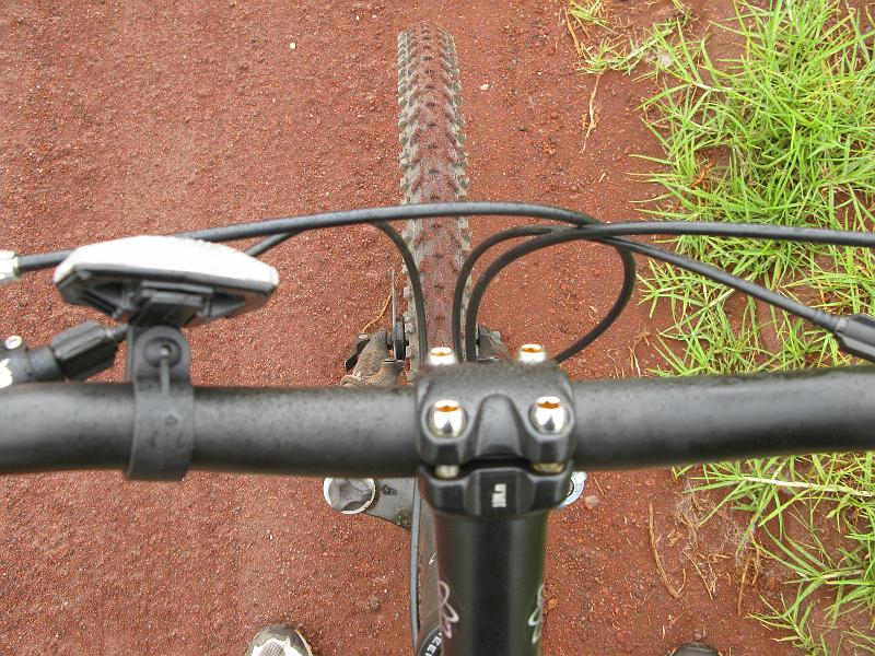 IMG_2406.JPG - For a lot of the climb this was my view. Head down, cranking it out. Dirt is sticking to tire because it has been raining the last half the way down.